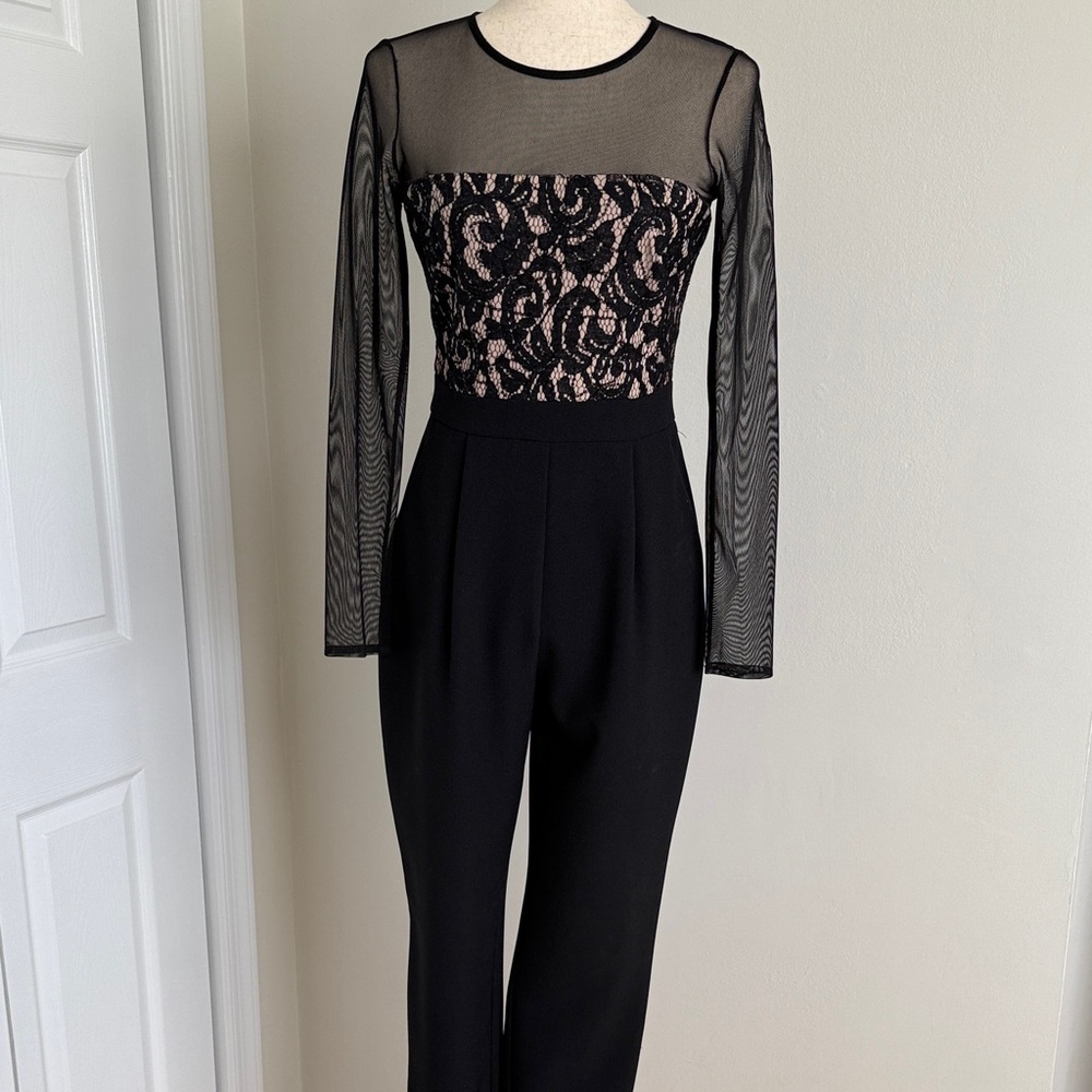 Vince Camuto Black and Nude Lace Jumpsuit with decorative detailing.